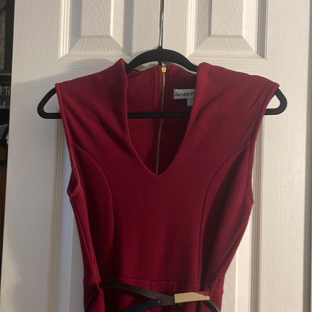 Burgundy jumper w/ black accessory belt